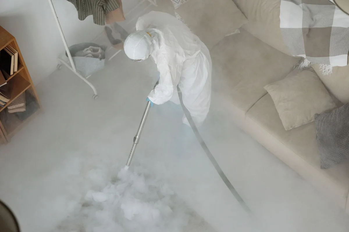 Biohazard cleanup technician in protective equipment, Meridian, TX